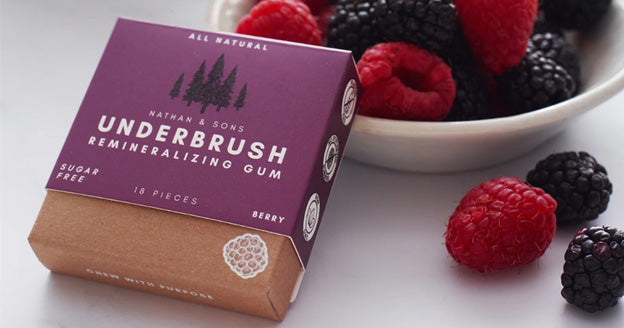 Berry gum beside raspberries and blackberries